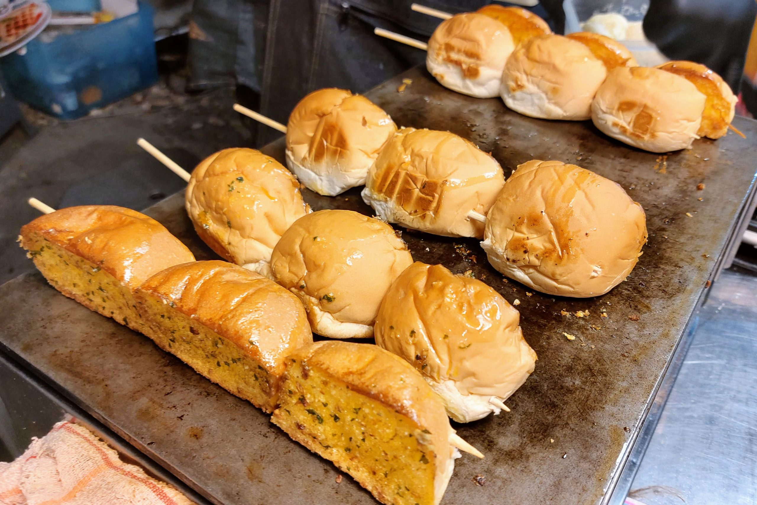 Garlic bread on a stick at Talad Lang Mor